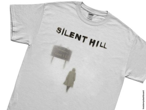 🕯️𝙎𝙄𝙇𝙀𝙉𝙏 𝙃𝙄𝙇𝙇 𝙄𝙉𝙏𝙊 𝙎𝙄𝙇𝙀𝙉𝙏 𝙃𝙄𝙇𝙇 𝙏𝙀𝙀 ! : this tee is a nod to the Silent Hill game and movie series. 🎁 Perfect Gift: Looking for a gift for a Silent Hill fan? This T-shirt is a thoughtful choice, perfect for birthdays, special occasions, or simply to share the love for this beloved cult classic series. 👕 Universal Sizing: Available in sizes from S to 3XL, different fits for fans of all sizes. 🌱 Made to Order: To combat waste and promote sustainability, each t-shirt i Silent Hill Shirt, Tshirt Graphics, Vintage T Shirt Design, Movie Series, Gaming Merch, Silent Hill, Classic Series, Classic Horror, Streetwear Men Outfits