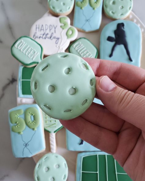 Pickleball Birthday Cookies 💙💚 Happy 50th Birthday Colleen • Decided to change my posting style a bit...I've been so busy these last 2 months, and I'm so grateful for it, but that means I can't film everything I do anymore. I'll be posting behind the scenes, though, as I go along... still have a lot to share with you 🥰 • #cookie #cookies #decoratedcookies #cookiesofinstagram #cookiehack #cookietip #cookiedecorating #satisfying #satisfyingreel #cookier #newcolors #thisweekscolors #jdsugarcooki... Pickleball Cupcakes, Pickleball Cookies, Pickleball Birthday, Sports Cookies, Cookie Hacks, Happy 50th Birthday, Happy 50th, Cookie Ideas, So Busy