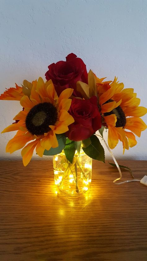 Rustic sunflower mason jar centerpiece with submersible fairy light string. Sunflower Wedding Centerpieces, Sunflower Wedding Decorations, Sunflower Centerpieces, Sunflower Party, Sunflowers And Roses, Sunflower Themed Wedding, Flowers For Home, Rustic Mason Jars, Rose Centerpieces