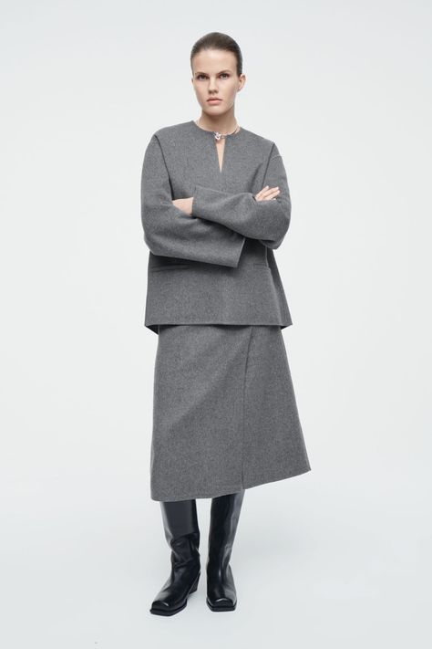 Underscored by a minimalist sensibility, this midi skirt is made from an RWS wool and TENCEL™ Lyocell blend that's double faced for a premium finish. It's cut in a classic A-line shape and has a folded pleat that loosens the silhouette. Regular fitZip closureThis product contains Responsible Wool Standard TE-00047206 (RWS) wool fiber from farms certified to animal welfare and land-management requirements Shell: 60% RWS wool, 40% TENCEL™ Lyocell. Excluding trims / Dry clean Back length of size 6 is 28.54" / Model wears a size 6 Wool Pleated Skirt, Wool Midi Skirt, Ageless Style, Black Midi Skirt, Vest Shirt, Animal Welfare, Gray Skirt, Skirt Suit, Trouser Jeans