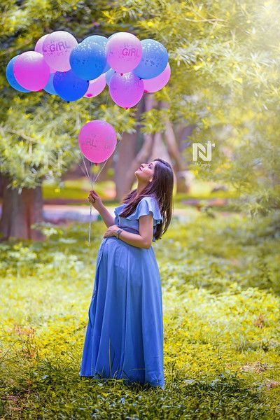 Gorgeous mom-to-be with balloons in her hand in the garden. Creative maternity portraits for the gorgeous mom-t0-be. Contact us now for pricing and packages. Indian Maternity Photos, Indian Maternity, Baby Bump Photoshoot, Maternity Dresses Photography, Maternity Photography Poses Outdoors, Maternity Photography Poses Couple, Pregnancy Photos Couples, Maternity Photography Poses Pregnancy Pics, Maternity Photography Outdoors