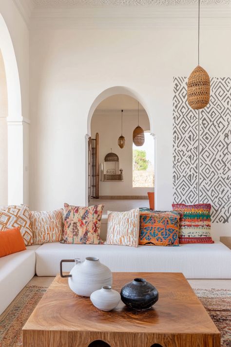 Learn how to recreate Moroccan decor in your own home. Fireplace Moroccan Tile, Morroco Living Room, Moroccan Room Ideas, Moorish Design Interiors, Morroco Interior Design, Contemporary Moroccan Interiors, Moroccan Interiors Living Room, Mediterranean Apartment Decor, Man Apartment