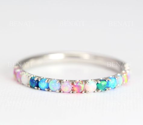 Exclusive to Benati Bridal. Half eternity wedding band set with multi color lab opal band. A symbol of ever lasting love - a perfect wedding or promise opal ring. Beautiful feminine opal eternity promise ring - a symbol of pure love! Beautifully set with rainbow lab opals. Opals go HALF way around the band. Total approx. width of ring: 2 mm. Size of stones: 2mm Select your gold of choice - 14k/18k solid white / yellow / red (rose) gold. Made to a high polish, top craftsmanship. Comfortable and s Formal Multicolor Opal Gemstone Ring, Formal Multicolor Opal Ring, Unique Multi-stone Opal Ring For Wedding, Opal Birthstone Ring For Wedding, Fine Jewelry, Classic Multi-stone Opal Ring For Formal Occasions, Mothers Rings, Wedding Band For Women, Elegant Wedding Rings, Opal Wedding Band