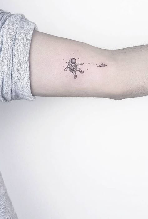 70+ Small and Adorable Tattoos by Ahmet Cambaz from Istanbul - TheTatt Cute Astronaut Tattoo, Minimalist Tattoo Space, Astraunaut Tattoo, Small Rocket Tattoo, Small Astronaut Tattoo Simple, Small Space Tattoos, Small Spaceman Tattoo, Small Cool Tattoos For Guys, Tiny Astronaut Tattoo