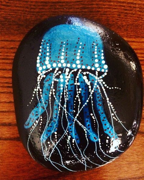 Jellyfish rock. #paintedrocks #kindnessrocks #artrocks #rocksofinsragram #jellyfish #blue #underthesea Jellyfish Rock Painting, Rock Painting With Paint Pens, Blue Painted Rocks, Painting Ideas Jellyfish, Mermaid Rock Painting, Jellyfish Blue, Summer Rocks, Happy Stone, Driftwood Signs