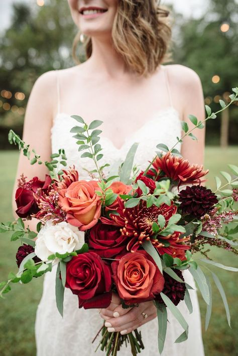 Red and orange bouquet. This collection of Burgundy Wedding Inspiration was designed to help you plan your dream wedding! Check out the Burgundy Wedding Ideas below which include colour schemes such as Burgundy, Marsala, Crimson and Dark Red. There are also some great burgundy wedding ceremony and reception ideas, as well as decor to match. #burgundywedding #burgundyweddingideas #burgundyweddinginspiration Orange Bouquet, Orange Bouquets, Red Bouquet Wedding, Winter Wedding Bouquet, Red Wedding Flowers, Red Bouquet, Winter Bouquet, Winter Wedding Flowers, Wedding Red