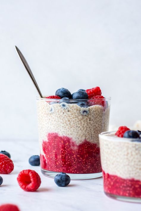 This chia seed pudding with fresh berries is SO easy to make, entirely plant based, and festive too! It requires only a few simple ingredients like chia seeds, dairy free milk, raspberries, blueberries, maple syrup, and vanilla extract to make. Prep time is just 10-15 minutes and it's delicious as a light snack or breakfast. Blueberry Chia Seed Pudding, Pumpkin Pie Chia Pudding, Paleo Friendly Snacks, Vanilla Chia Seed Pudding, Vanilla Chia Pudding, Chia Seed Recipes Pudding, Easy Pumpkin Pie, Light Snacks, Chia Seed Pudding