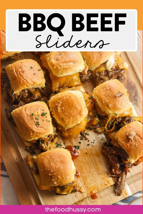 BBQ beef sliders are loaded with tender, juicy shredded beef smothered in rich, smoky barbecue sauce and melty cheese served on soft mini buns. These bite-sized delights pack a flavorful punch perfect for any gathering. Sides For Bbq Beef Sandwiches, Beef Brisket Sliders, Shredded Beef Sliders, Bbq Beef Sliders, Barbecue Sliders, Chicago Beef, Brisket Sliders, Bbq Beef Sandwiches, Bbq Sliders