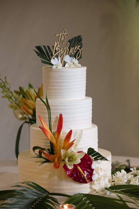 Simple white wedding cake with tropical touches Wedding Cake Designs Tropical, One Tier Tropical Wedding Cake, 3 Tier Tropical Wedding Cake, Luau Wedding Cake, Tropical Wedding Cake Designs, Mexico Wedding Cake, Hawaiian Wedding Cake Design, Tropical Chic Wedding Cake, Tropical Theme Wedding Cake