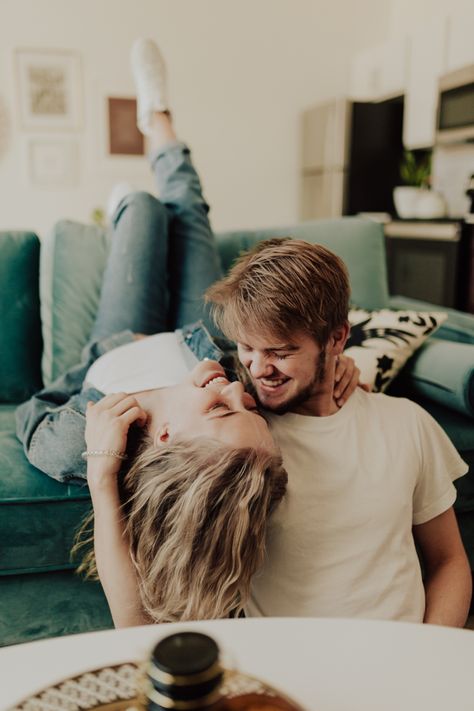 Laughing Couple during an In-Home Couple Photoshoot Sofa Poses Photo Ideas Couple, Couples Comfy Photoshoot, Couple Poses Photography Indoor, Jeans Photoshoot Ideas Couple, Couple Photoshoot Poses At Home, Comfy Couple Photoshoot, Intimate Indoor Couple Shoot, Couch Photoshoot Ideas Couple, Inside Couple Photoshoot