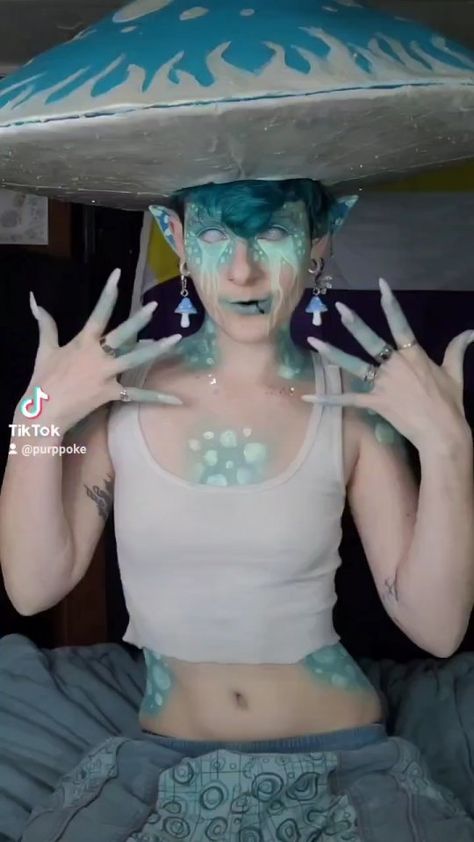 izzybizarre on Instagram: Im learning new transitions! Can you tell? 😅 💙🍄💙🍄💙 #Mushroom #MushroomMakeUp #Makeup #Nonbinary #Cryptid #BodyPaint #Blacklight #Goblin… Blue Mushroom Makeup, Mythical Creature Costume Ideas, Nonbinary Halloween Costumes, Cryptid Makeup, Goblin Core Makeup, Cryptid Costume, Mushroom Costume Women, Mushroom Costumes, Goblin Makeup