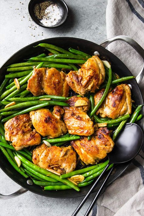 This one-pan Garlic Chicken Thighs and Green Beans Skillet is easy to make and the perfect choice for simple dinners or meal prep. Featuring pan-seared chicken thighs and buttery green beans, every bite is bursting with flavor! Chicken And Green Beans Skillet, Green Bean Recipes Healthy, Pan Seared Chicken Thighs, Green Beans With Almonds, Honey Garlic Chicken Thighs, Easy Chicken Thigh Recipes, Frozen Green Beans, Baked Chicken Thighs, Boneless Skinless Chicken Thighs