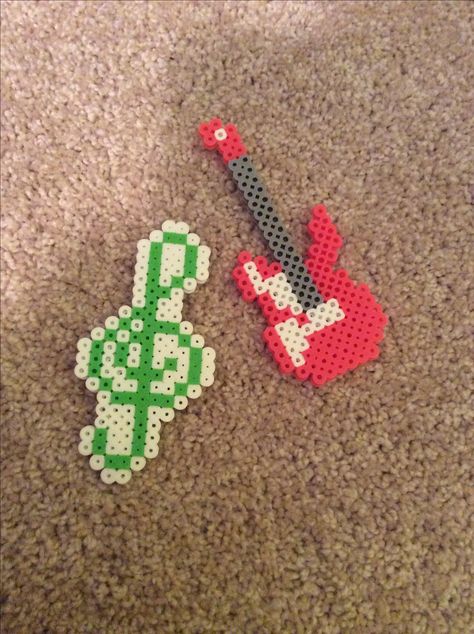 Music perler beads! -Electric guitar -Treble clef Electric Guitar Pixel Art, Perler Bead Guitar, Guitar Perler Beads, Perler Bead Music, Sunflower Iphone Wallpaper, Modele Pixel Art, Melty Bead Patterns, Beaded Banners, Pearl Beads Pattern