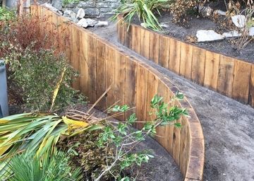 Retaining Sleeper Wall Railroad Tie Fence, Reclaimed Railway Sleepers, Sleeper Wall, Sleeper Retaining Wall, Wood Retaining Wall, Greenhouse Base, Oak Sleepers, Railroad Tie, Brick Feature Wall