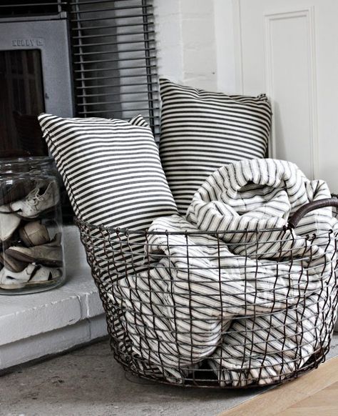 23 Pretty Ways to Use Baskets As Extra Storage in Small Spaces | Brit + Co Smart Tiles, Wire Basket, Blanket Storage, My New Room, Living Room Inspiration, Apartment Living, Concept Store, Interior Design Living Room, Cozy House