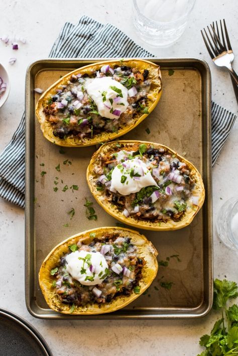 A healthy and satisfying Taco Stuffed Spaghetti Squash recipe made with taco-seasoned chicken, black beans, peppers, onions, and cheese. Chicken Black Beans, Stuffed Spaghetti Squash, Isabel Eats, Spaghetti Squash Recipe, Cholesterol Free Recipes, Healthy Mexican Recipes, Poblano Peppers, Meat Free Recipes, Healthy Mexican