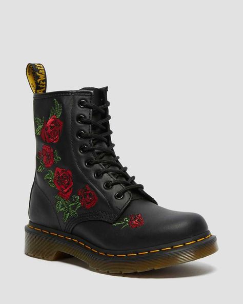 The 1460 was the first Dr. Martens boot — and this one is true to the original, but borrows style from the 14-eye 1914 Vonda, with embroidered roses cascading down the side of the boot. 8-eye boot Retains classic Docs DNA, like grooved edges on its air-cushioned sole, yellow welt stitching and a scripted heel-loop Built on top of the iconic AirWair™ Bouncing Soles Goodyear-welted product Made with Softy T, a lightweight, full-grain leather treated to have a naturally soft and supple feel Shoes Wishlist, Lace Up Boots Women, Dr Shoes, Floral Boots, Yellow Heels, Embroidered Roses, Leather Lace Up Boots, Doc Martens, Leather Lace