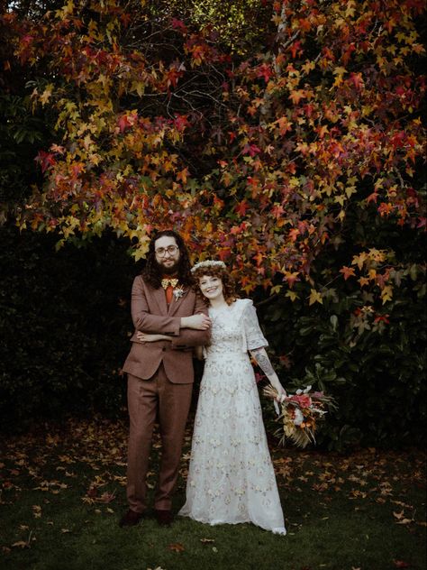 Late october autumn wedding in Surrey, UK. Bride’s dress by Needle and Thread. Groom’s suit by Gianni Feraud. Photo by devlinphotos Flowers by thedriedflowercollection21 Makeup by makeup_by_millierose Curls crafted by spookyruno #autumnwedding #fallwedding #rocknrollbridemagazine #rockmywedding #alternativebride #curlyhair #curlyshag #bohowedding #weddingonabudget Needle & Thread Wedding Dress, Autumn Boho Wedding, Rock N Roll Bride Magazine, Late Fall Wedding, Autumn Wedding Decor, Needle And Thread Dresses, Late Summer Wedding, October Flowers, Autumnal Wedding