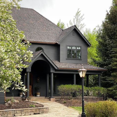 JULIA MARCUM · homebody 🏡 on Instagram: “Everything is blooming and green here right now. It’s the first time we’ve seen our exterior against such a lush background and I can’t…�” Benjamin Moore Graphite Exterior, Benjamin Moore Graphite, Julia Marcum, Rustic Family Room, Witches Cottage, Game Room Basement, Cabin Exterior, Gorgeous Houses, Farm Cottage