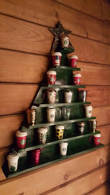 Christmas tree Starbucks ornament cup holder.  It can hold up to 43 ornament cups. #Starbucks #Christmas Starbucks Christmas Ornaments, Starbucks Tree Christmas, Starbucks Themed Christmas Tree, Starbucks Ornaments Display, Starbucks Christmas Decorations, Mug Tree Ideas, Starbucks Decorations, Starbucks Christmas Tree, Starbucks Ornaments