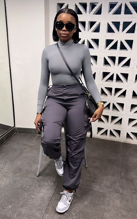 Cargo And Jumper Outfit, Cargo Jumpsuit Outfit Black Women, Fitted Cargo Style Jumpsuits For Spring, Travel Outfit Black Women, Denim Cargo Jumpsuit, Casual Denim Cargo Style Jumpsuit, Comfy Airport Outfit, Cargo Outfit, Neat Casual Outfits