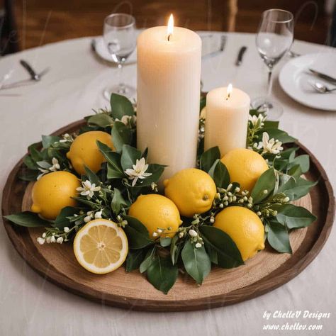 47 DIY Lemon Centerpieces - Easy Whole Lemon Centerpieces for Every Wedding Theme - by ChelleV Lemon Sunflower Centerpieces, Lemon Party Table Decor, Tuscany Wedding Theme Centerpieces, Italian Themed Decor, Lemons Centerpieces Ideas, Fruit And Flower Wedding Centerpieces, Lemon Ideas Decor, Bridal Shower Table Centerpieces Diy, Lemon Centerpiece Ideas Wedding