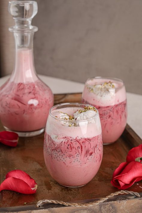 Homemade Vegan Falooda recipe is easy to pull off and healthy. Infused with the flavour of rose, this Indian drink, which can also be enjoyed as a dessert, is made with milk, strands of jelly, basil seeds and topped with coconut ice cream and crushed pistachios. Zero added sugar and naturally sweetened with dates. Crushed Pistachios, Falooda Recipe, Ice Cream Aesthetic, Indian Drinks, Frosting Recipes Easy, Recipes With Whipping Cream, Homemade Jelly, Rose Flavored, Basil Seeds