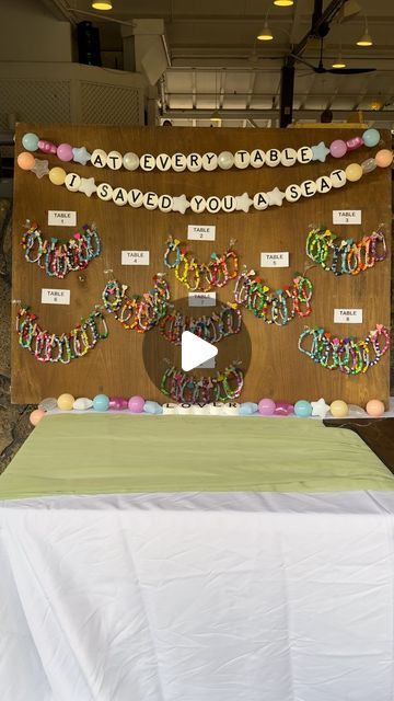 QUEER EVENT PLANNER 🌈🏳️‍🌈 on Instagram: "Our swiftie hearts melted with this friendship bracelet seating chart 🥹💜  Not only making such a cute idea for a seating chart but as favors for all those guests too. Each person found their friendship bracelet under what table they’d be sitting at, and everyone loved it (especially us 🥲)!   Making your wedding your own looks like details like these. Incorporating parts of what makes you and your partner who you are and sharing pieces of your love story will always be what makes a wedding special.   . . .  #hawaii #hawaiiweddings #weddingplanner #weddingdecor #weddingideas #weddingtips #nontraditionalwedding #tswift #swiftieforever" Friendship Bracelet Wedding Favor, Friendship Bracelet Seating Chart, Wedding Friendship Bracelet, Swiftie Wedding Ideas, Swiftie Wedding, Lei Ideas, Queer Weddings, Graduation Leis, Wedding 2024