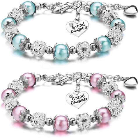 PRICES MAY VARY. Cute Bracelets Set: there are 2 pieces of granddaughter charm bracelets for hers in soft and bright color, with some lovely charm making them more eye catching, which is suitable for matching clothes and hair styles Reliable Material: these heart charm pendant bangles are made of 8 mm simulated pearls, 8 mm colorful crystal beads and metal heart pendant with letter of [Grand Daughter]; The metal heart pendant can be removed Nice Gift Choice: you can give these beautiful and prac Heart Beaded Bracelets, Gifts For Niece, Sellable Crafts, Girls Bracelets, Granddaughter Gifts, Charm Bracelets For Girls, Grand Daughter, Matching Clothes, Crystal Balls