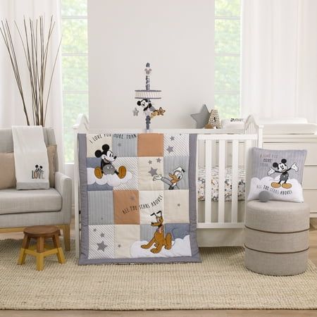 The Love Mickey 3 Piece Crib Bedding Set includes a 34" x 43" comforter, a 28" x 52" fitted crib sheet, and crib skirt with a 14" drop length. This comforter features Mickey Mouse with his friends Donald Duck, and Pluto up in the clouds among stars and stripes, with a sweet saying, "I Love You More Than All The Stars Above!" Beautifully crafted patchwork design comes in shades of gray, white, charcoal, tan, and black. The crib sheet is made of 100% cotton and is featured in a playful pattern of Disney Baby Nurseries, Mickey Mouse Love, Disney Nursery, Toddler Mattress, Soft Baby Blankets, Nursery Crib, Baby Nursery Furniture, Crib Bedding Sets, Fitted Crib Sheet