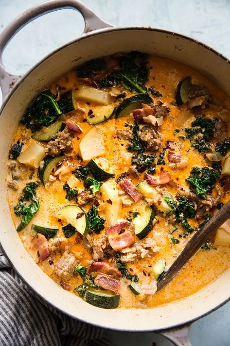 Bacon, sausage, heavy cream, garlic and parmesan cheese, plus a few veggies thrown in for good measure—our rich, delicious zuppa toscana recipe has it all, and then some! Continental Recipes, Toscana Recipe, Creamed Kale, Salmon Chowder, Creamy Soup Recipes, Zuppa Toscana Soup, Tuscan Soup, Toscana Soup, The Modern Proper