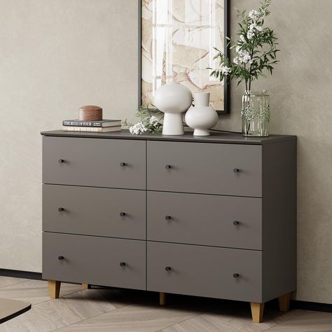 PRICES MAY VARY. Modern Kids Dresser: Combined with dark grey finish surface, black knobs, and oak brown solid wood legs add a touch of elegance to any room. 32.4" Height makes you access and place the items without any effort. Ample Storage Space: There are 6 deep drawers each of which measures 20.9" L x 11.3" W x 5.9" H, this beige baby dresser is great to organize your clothes, blankets, etc. As well as the 47.2"x15.3" wide tabletop is perfect for displaying lamps, books, etc. The bedroom dre Chest Of Drawers Modern, Black Knobs, Wall String Lights, Wood Closet, Beige Cabinets, Dresser Tv Stand, Baby Dresser, Dresser For Bedroom, Drawers Dresser