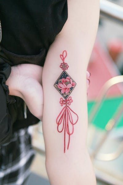 Lotus flower good luck charm tattoo | www.otziapp.com Charm Tattoo, Korean Tattoo, Petit Tattoo, Korean Tattoos, Tatuaje A Color, Japanese Sleeve Tattoos, Red Tattoos, Japanese Tattoo Designs, Tattoo Inspirations