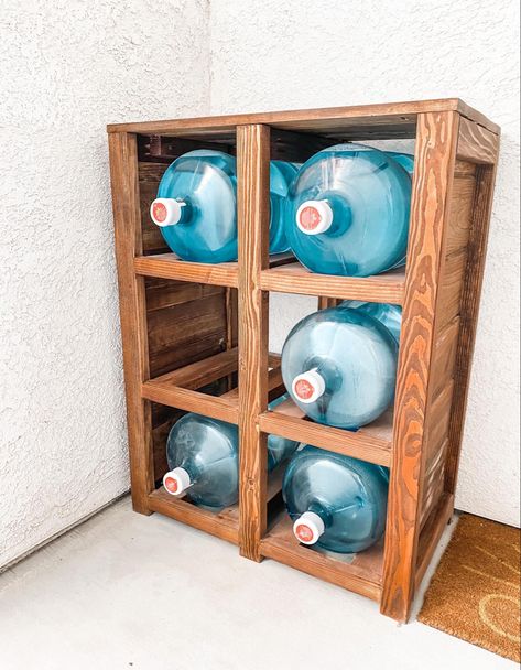 Needed a spot to put our water bottles when they were delivered. DIY’ed it with left over wood I had. How To Hide 5 Gallon Water Bottles, Diy 5 Gallon Water Bottle Storage, 5 Gallon Water Jug Ideas Diy Storage, Gas Bottle Projects, Water Bottle Storage Rack, Craft Storage Diy, Glass Water Jug, Pocket Holes, Gallon Water Jug