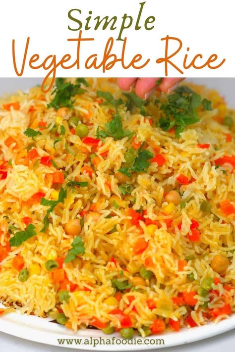 This vegetable rice pilaf (aka yellow turmeric rice) is packed with mixed vegetables and a combination of aromatics and spices for a truly flavorful (and colorful), versatile side dish! This simple Middle Eastern-inspired rice and vegetable side is fluffy and flavorful, gluten-free, vegan, and ready in under 40 minutes! Rice Pilaf With Vegetables, Basmati Yellow Rice Recipe, Garlic Turmeric Rice, Rice Pilaf Recipe Vegetable, Vegetable Rice Recipe, Vegetable Rice Pilaf, Vegetarian Rice Dishes, Chicken Manchurian, Seeds Recipes