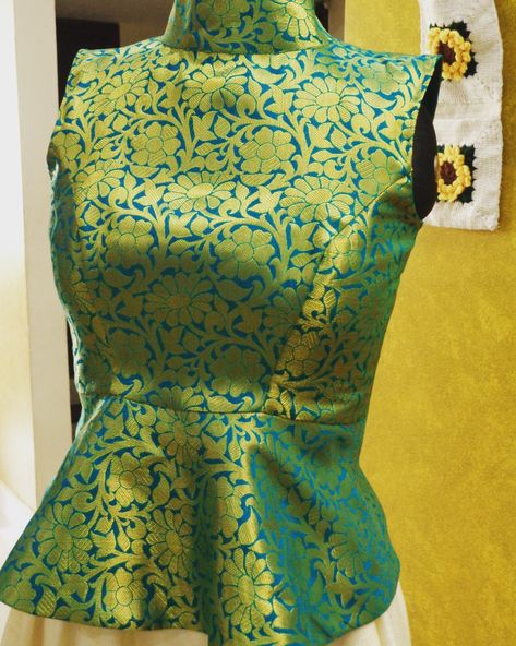 Green brocade peplum crop top with standing collar Brocade Crop Top Designs, Brocade Peplum Top, Brocade Top Designs, Stand Collar Blouse Indian, Brocade Crop Top, Long Blouse Designs, Stand Collar Blouse, Blouse Tops Designs, Model Blouse