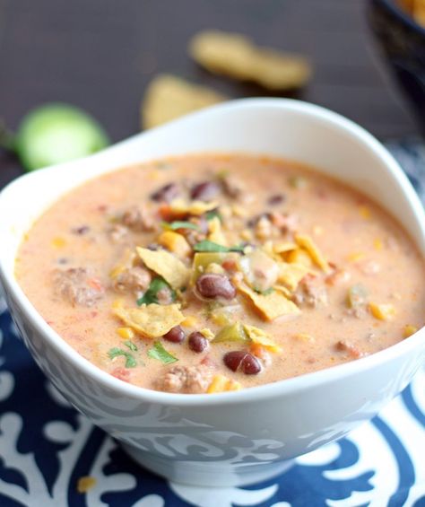 This Slow Cooker Beefy Nacho Soup has all of the deliciousness of cheesy nachos packed right into it! This soup is so simple to make and will become an instant favorite! Nacho Soup Recipe, Nacho Soup, Ground Beef Ideas, Beef Ideas, Cheesy Nachos, Soup Stew Recipes, Soup Of The Day, Tray Bake Recipes, Recipes From Scratch