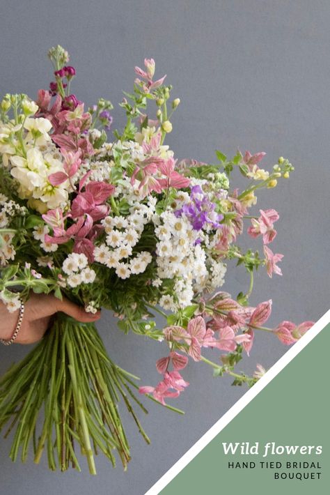 A wild flower bouquet is perfect for a laid-back bride. This one was made with all British flowers for a beautiful 'just picked' look. Combining just daisies with clary sage makes this pink and white wedding flower bouquet really stand out. Each of our wedding bouquets is made to order, so we can find something perfect for each and every bride - whatever the colour, shape, size or style they're after. Pink And Green Wildflower Bouquet, Pink Wild Flower Bouquet, Pink Wildflower Bouquet, Wildflower Arrangements, White Wedding Flowers Bouquet, Wild Flower Bouquet, Foliage Bouquet, Pink And White Wedding, Bouquet Champetre