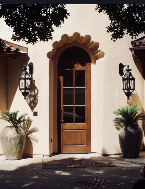 This entryway is complete with these outdoor wall sconces.  This is a California home we did last year. Spanish Decorating Ideas, California Hacienda, Iron Light Fixtures, Spanish Style Exterior, Spanish Inspired Home, Wrought Iron Light Fixtures, Carriage Lights, Spanish Exterior, Modern Hacienda