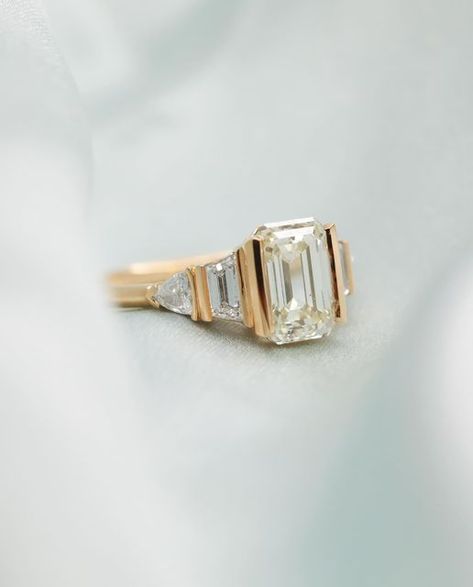 Grew & Co Fine Jewellery on Instagram: "Remi -  a light yellow semi bezel emerald cut diamond, framed by a pair of trapezoid and trilliant cut diamonds 💎" Asscher Cut Engagement Rings, Vintage Style Engagement Rings, Emerald Cut Diamond, Dream Engagement, Dream Engagement Rings, Asscher Cut, Vintage Engagement, Emerald Cut Diamonds, Yellow Diamond