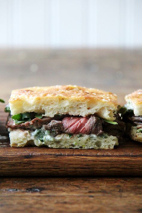 In these skirt steak sandwiches, skirt steak is layered with arugula between slices of focaccia smeared with herbed mayonnaise. Focaccia Steak Sandwich, Alexandra Cooks, Samin Nosrat, Skirt Steak Recipes, Steak Sandwiches, Brunch Buffet, Steak Sandwich, Skirt Steak, Iron Skillet