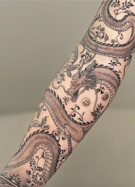 37+ Dragon Tattoo Ideas to Ignite Your Inspiration Today! (With Pictures) Mens Dragon Sleeve Tattoo, Modern Dragon Tattoo, Dragon Tattoo Sleeve For Men, Dragon Band Tattoo, Delicate Dragon Tattoo, Dragon Wrapped Around Leg Tattoo, Arm Tattoo Dragon, Forearm Dragon Tattoo, Colorful Dragon Tattoo