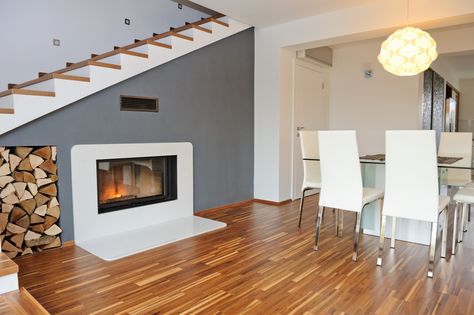 Modern interior living room with view on fire place Fireplace Under Stairs, Installing Tile Floor, Coretec Flooring, Coretec Plus, Vinyl Wood Flooring, Real Hardwood Floors, Flooring Store, Luxury Vinyl Plank Flooring, Waterproof Flooring