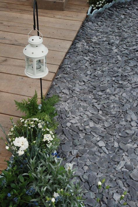 Black slate chippings adding dimension to this wooden walkway. Slate Driveway Ideas, Slate Landscape Rocks, Slate Gravel Patio, Black Slate Landscaping, Black Slate Landscape Rock, Slate Stone Landscaping, Slate In Garden, Slate Rocks Landscaping, Slate Front Garden