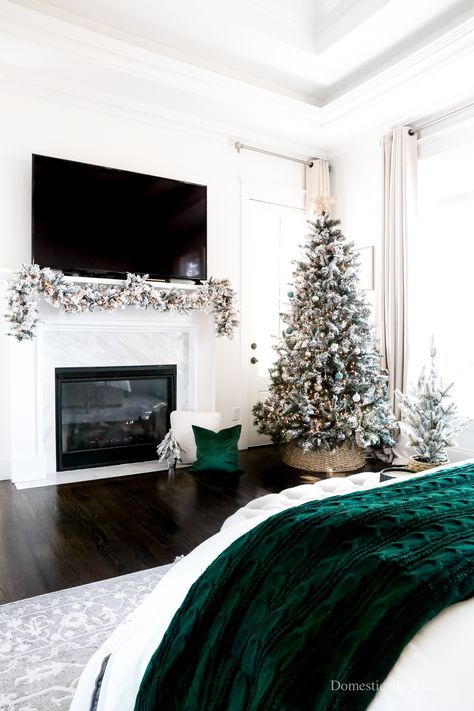 Cozy Christmas Bedroom Decor tour with flocked trees and flocked garland with forest green accents. | Neutral Bedframe with white duvet cover. | Neutral bench and christmas pillows. | White three Christmas printable frames. | Beautiful large rug, oversized. | Cream neutral nightstands with matching set of lamps. | Master bedroom holiday Christmas decor. |Christmas decorations and throw pillows with tray and little christmas tree. | 2022 Holiday decor collection for your master bedroom and home. Neutral Nightstands, Door Decorations Christmas, Cozy Christmas Bedroom, Domestically Blissful, Diy Christmas Door Decorations, Tree Bedroom, Christmas Bedroom Decor, Flocked Garland, Holiday Bed