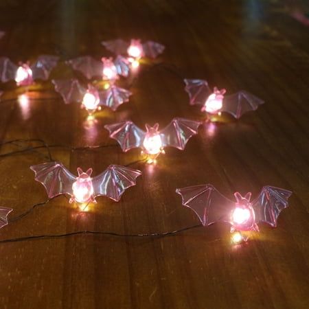 Bring spooky fun to your indoor space with these bat string lights. This battery-operated string of bat lights is the perfect way to add an eerie glow to Halloween wreaths, garlands and other dcor accents. Size: 6'.  Color: Purple. Cute Colorful Halloween Decor, Bat Lights, Bat Icon, Halloween Window Display, Led Purple, Halloween Theme Birthday, Purple String Lights, Bat Light, Halloween String Lights