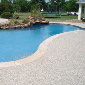 Different Types of Pool Decking | Custom Pool Decking Swimming Pool Images, Deck Renovation, Decks Around Pools, Pool Decking, Cheap Pool, Fiberglass Swimming Pools, Gravel Patio, Pool Renovation, Pool Colors