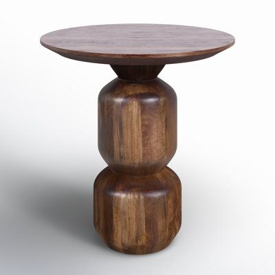 We love having an extra surface to rest drinks and other quick-grab items. Our round end table is a great addition for your living room or den setup. Crafted from solid mango wood, it comes in a warm dark brown tone with a lacquered finish up top that highlights natural grain variation for a hint of rustic charm. The pedestal base shows off a stacked silhouette, bringing a hint of geometry and mid-century modern style to your space. AllModern Rafaella Solid Wood Pedestal End Table in Brown | Siz Highlights Natural, Pedestal End Table, Wood End Table, Round End Table, Wood Accent Table, Brown Tone, Wood Pedestal, Wood End Tables, Solid Mango Wood