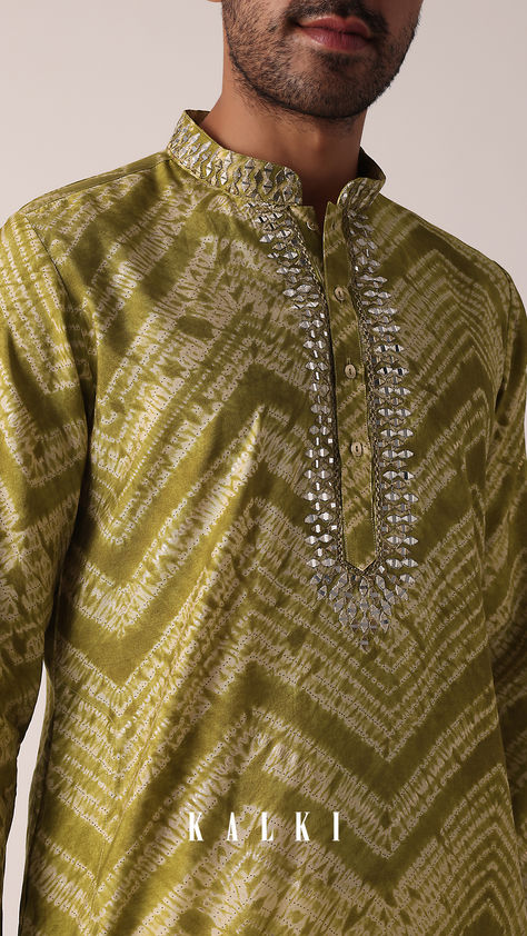 "Step into festivities with our Captivating Green Cotton Kurta. It is adorned with an enchanting all-over print and intricate mirror work on the yoke. This single kurta piece features a mandarin collar, full sleeves, and a harmonious blend of Green and Pista Green tones. Elevate your festival style effortlessly with this unique ensemble. " Cotton Kurta For Men, Intricate Mirror, Kurta For Men, Pista Green, Festival Style, Cotton Kurta, Green Tones, Mirror Work, Kurta Set