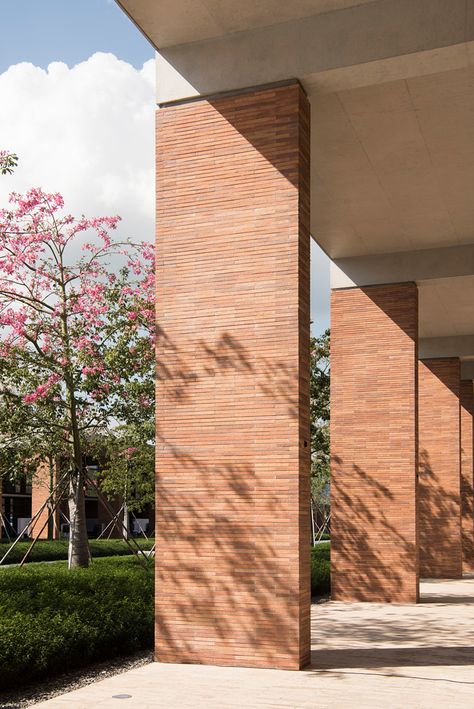 Credit: Nigel Young / Foster + Partners Chinese University, Building Columns, Urban Hotels, Mountain Architecture, Brick Columns, Architectural Columns, Brick Interior, Mixed Use Development, Foster Partners